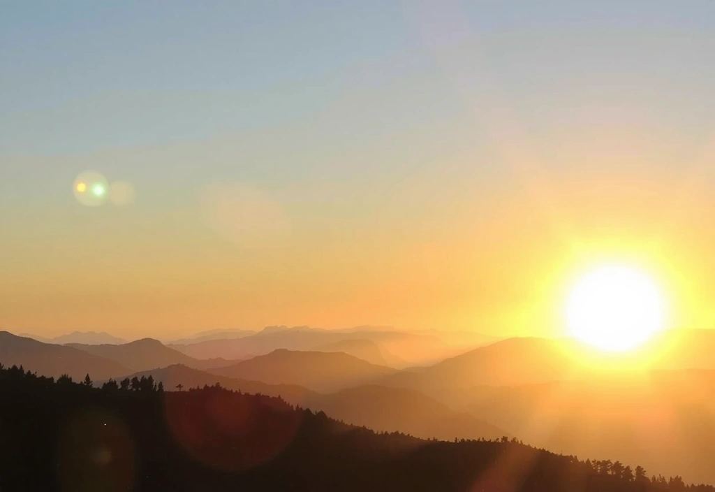 A serene image of a sunrise over mountains, representing renewal and daily energy